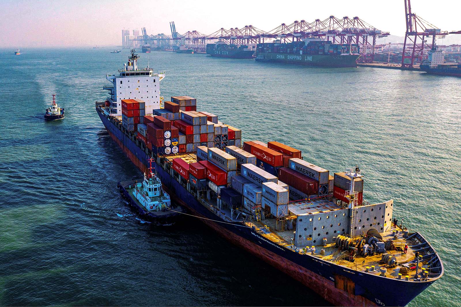 A cargo ship loaded with containers makes its way at a port in Qingdao in China's eastern Shandong province on January 14, 2020. - China's trade surplus with the United States narrowed last year as the world's two biggest economies exchanged punitive tariffs in a bruising trade war, official data showed on January 14, on the eve of a deal to ease tensions. (Photo by STR / AFP) (Photo by STR/AFP via Getty Images)
